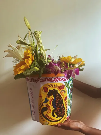 This is the third side of the multi-faceted planter, featuring a powerful panther design with folk-art motifs. This single item showcases a range of styles, from portraiture to animal art.