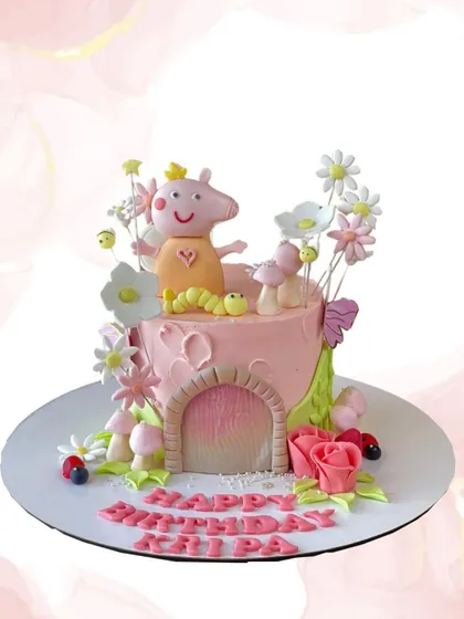 Oink oink! A delightful Peppa Pig cake for Kaipa's birthday. This design features Peppa in a whimsical garden scene with sugar flowers and a cute little door.
