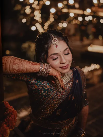 A serene and beautiful close-up of the bride, her intricate henna and jewelry on full display.