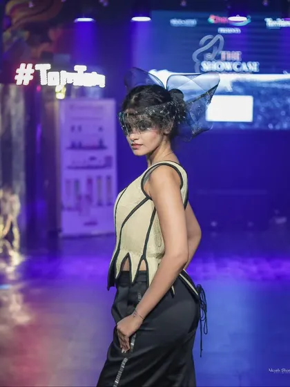 A model strikes a pose in an avant-garde piece from 'The Showcase Project'. My photography highlights the unique structure and design of creative fashion.