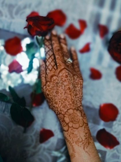A creative, blurry shot of the floral henna, creating an artistic and dreamy look.