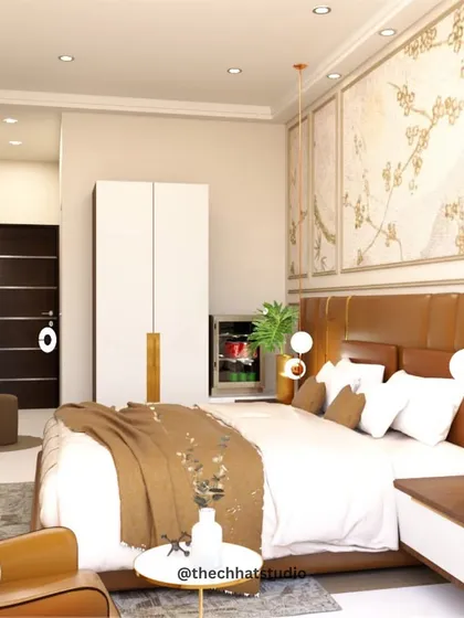 This view of a hotel master bedroom highlights the blend of textures and materials. The custom leather headboard is complemented by a delicate, nature-inspired wall mural and elegant pendant lighting, creating a space that is both refined and welcoming.