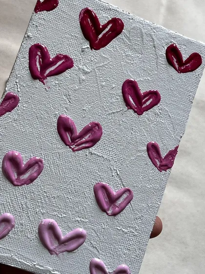 Texture painting is a wonderful form of art therapy. This small canvas features hearts I created with a thick paste. The feeling of applying and shaping the texture is amazing, and I encourage you to try it.