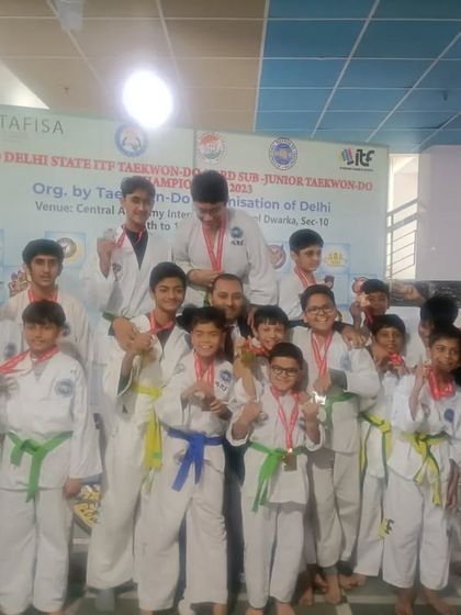 The whole team gathers for a photo after a successful run at the Delhi State Championship.