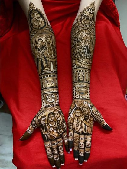 This mehndi is a tribute to family bonds, featuring portraits of the couple with their parents on the palms and other family members on the forearms.