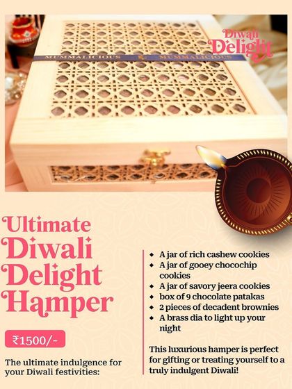 The "Ultimate Diwali Delight Hamper," a luxurious wooden box filled with cookies, brownies, chocolate patakas, and a brass diya.