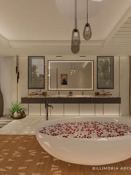 A closer look at the freestanding tub and the double vanity in the background. The design uses a mix of materials, including wood, marble, and pebbles, to create a rich, textural experience.