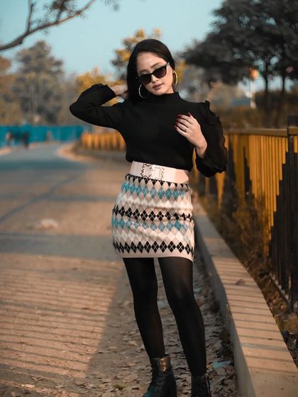 A walking shot that gives a sense of movement and style, perfect for a fashion lookbook.