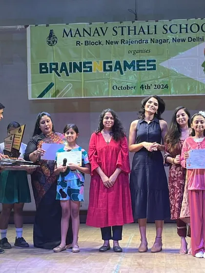 On stage at Manav Sthali School, presenting awards to talented students. It is a privilege to guide and recognize the dedication of young performers.