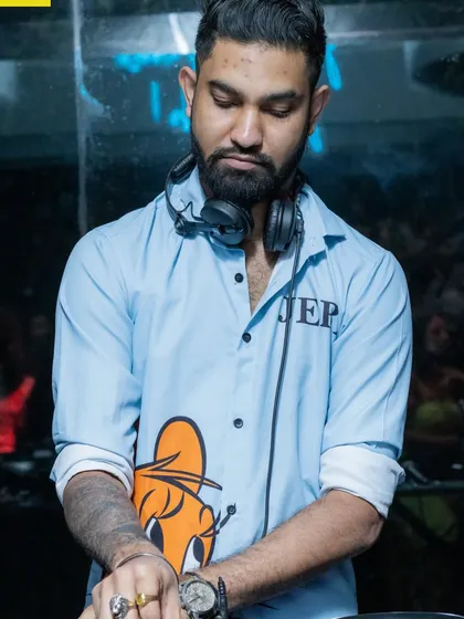 A moment of concentration while DJing. It takes hours of preparation to deliver a set that feels effortless and keeps the dance floor moving all night long.
