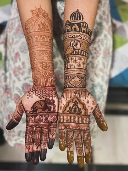 This destination wedding mehendi was so much fun to create. I incorporated elements like an elephant on the palm and a beautiful monument on the forearm to match the couple's story and wedding theme.