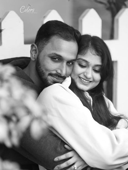 A warm and gentle embrace captured in a classic black and white portrait.