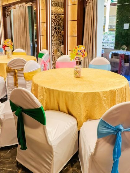 Even the seating gets a colorful makeover! For this art-themed party, I used multi-colored chair sashes to tie the entire look together, ensuring every corner of the venue was vibrant and festive.