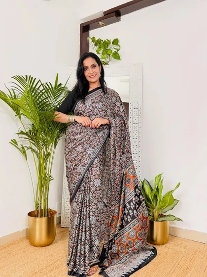 This printed satin crepe saree is a great example of a stylish workwear option. The fabric is soft, easy to manage, and the print is subtle enough for a professional environment.