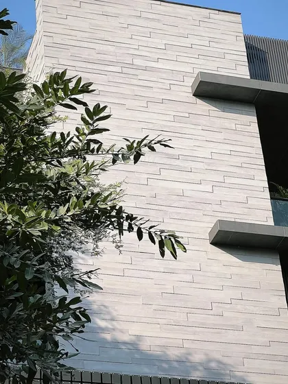 The texture and detail of our concrete facade planks. This solution is perfect for achieving a wood look in climates where real wood would be impractical.