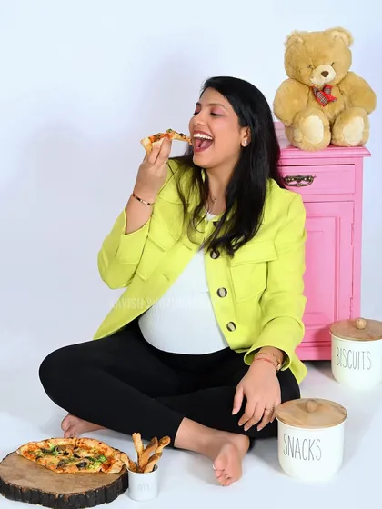 Another joyful shot from the pizza-themed maternity session, full of laughter and personality.