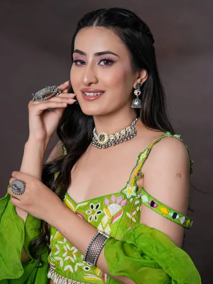 A bold pink winged liner adds a fun pop of color to this look. Paired with silver jewelry, it's a great makeup choice for a festive event like Mehendi or Sangeet.