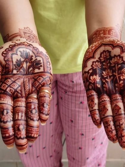 The rich, dark stain of an intricate lotus design for Diwali. This shows the beautiful result of my organic henna on the palms.