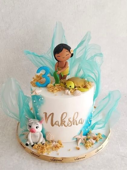 A beautiful baby Moana cake for Naksha's 3rd birthday. The design features delicate rice paper sails to represent the ocean waves.
