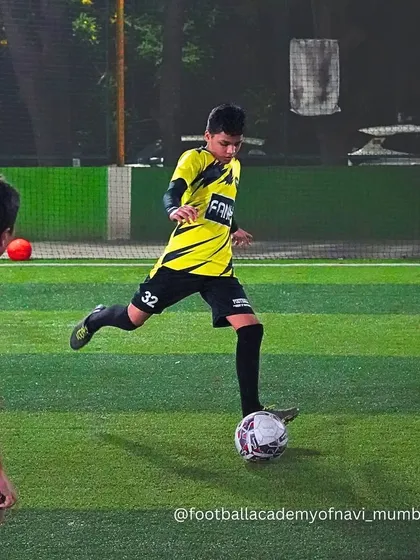 A player prepares to pass the ball during a practice match, demonstrating awareness and vision.
