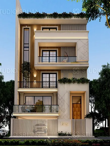 Another design for a 200 sq. yard home in Kirti Nagar. This elevation uses a combination of recessed balconies and gold-tone metal details to create a luxurious and contemporary look.