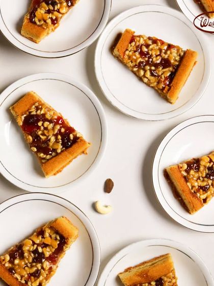 An overhead view of our unique Flouretart slices. This old-timer recipe features a rich filling of cashews and raisins on a shortbread crust, a truly special treat.
