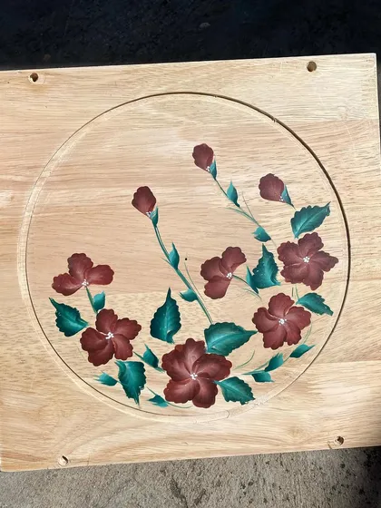 A panel with deep red, hibiscus-like flowers.