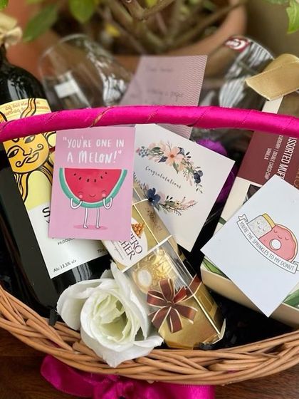 This vibrant anniversary basket is designed for a fun loving couple. It includes a bottle of non alcoholic wine, Ferrero Rocher chocolates, assorted muffins, and quirky, cute cards like "You're one in a melon!" to add a playful touch to their celebration.