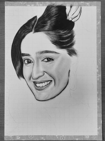 See how I drew Niharika NM's portrait. These images show the process from the initial grid and eye sketch to the final rendering of her hair and smile.
