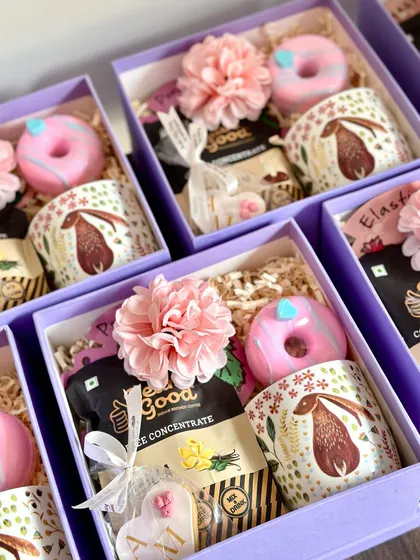 Celebrating a new arrival is one of our favorite things to do. These adorable baby shower return favors are both budget-friendly and full of charm, containing a cute coffee mug, a donut-shaped soap, coffee concentrate, and a personalized cookie.