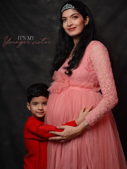 A precious moment between a mom-to-be and her son. This photo shows that maternity shoots can be a beautiful way to celebrate the whole family.