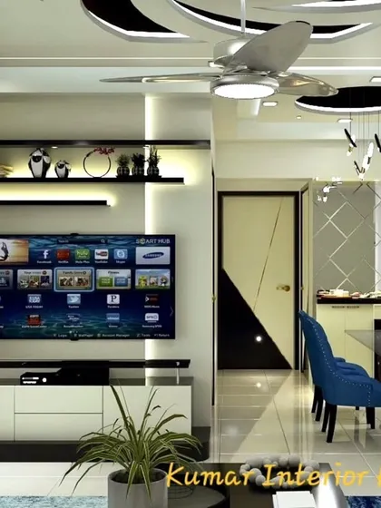 A closer look at the TV and entertainment unit. The backlit shelves provide a stylish space for decor, while the white console offers practical storage.
