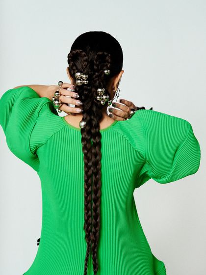 A final look at the detailed, sculptural hairstyle from the back.