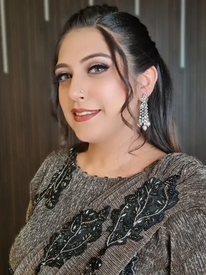 Beautiful Diksha, with makeup by my senior artist. This close-up shows the soft, shimmery eye makeup and perfectly defined brows.