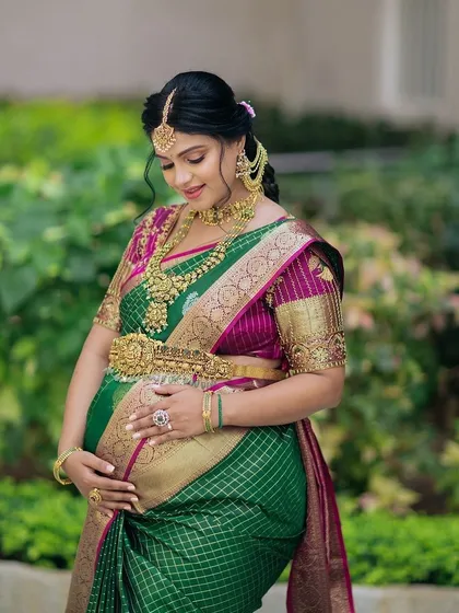 Celebrating motherhood is a joy, and I love styling for Seemantha ceremonies. This mom-to-be is glowing in a complete temple jewellery set, featuring a statement necklace, matching earrings, and a traditional waist belt that beautifully accentuates her baby bump.
