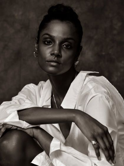 A confident and engaging black and white portrait.