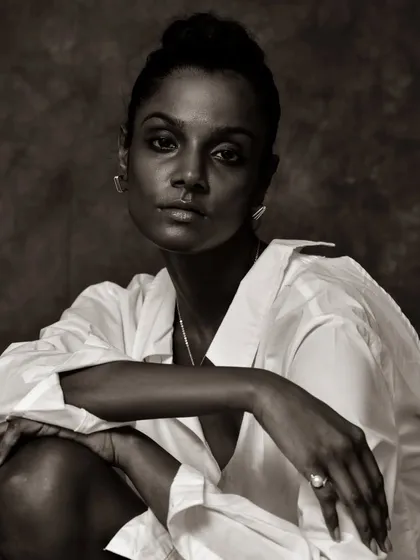 A confident and engaging black and white portrait.