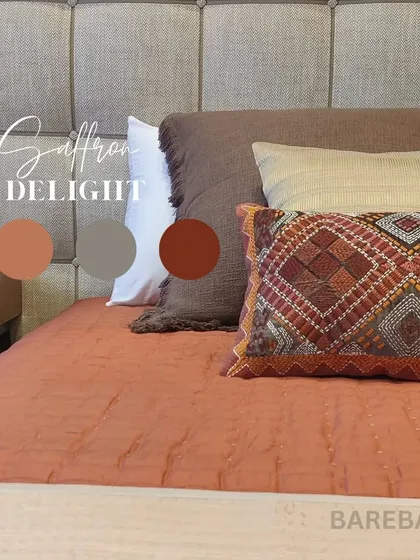 A saffron delight. This bedding combination from our Rustomjee Elements project in Mumbai shows how we layer colors and textures, from the embroidered pillow to the soft quilt.