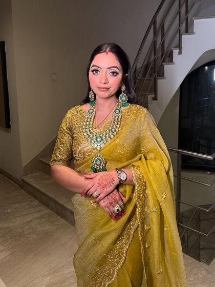 The complete look for this wedding guest. She looks poised, elegant, and ready for the celebration.