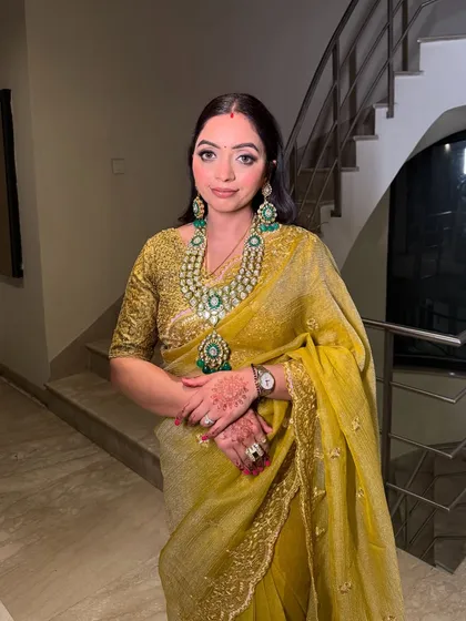 The complete look for this wedding guest. She looks poised, elegant, and ready for the celebration.