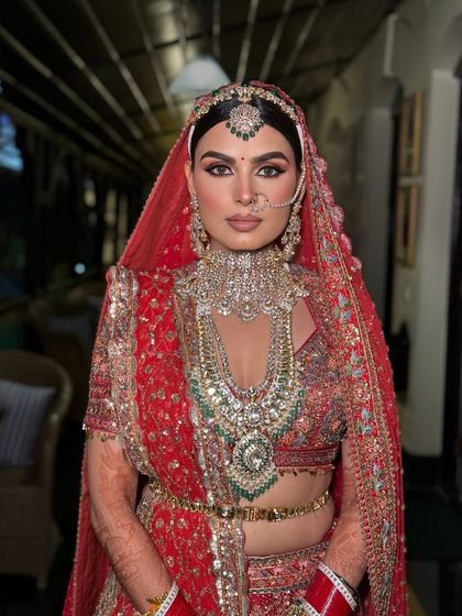 A powerful portrait of my bride Kanu. Her makeup is bold yet classic, a perfect match for her regal Anita Dongre ensemble.