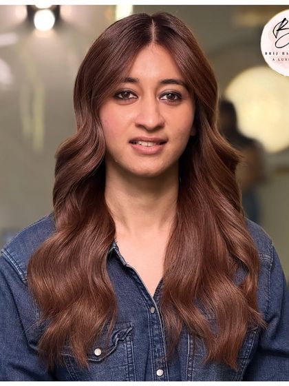 A full-face view showing how this rich brown color complements the client's features and gives her a glamorous vibe.