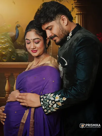 We celebrate love in all its forms, including the beauty of tradition. This couple's maternity portrait showcases a classic Indian style, with the mother-to-be in a beautiful purple saree and her partner in an embroidered jacket, creating a timeless and elegant memory.