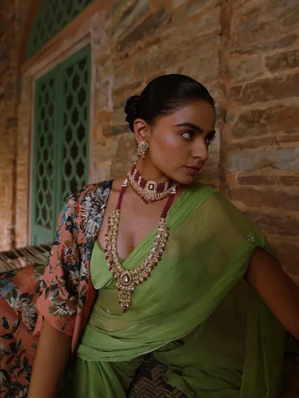 A closer look at the jewellery and the model's serene expression. This is a perfect example of styling for a high-end jewellery campaign.