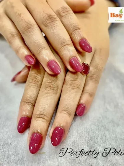 Sometimes, a single color is all you need for a perfectly polished look. Here are beautifully shaped almond nails with a flawless application of a rich, glossy magenta gel polish.