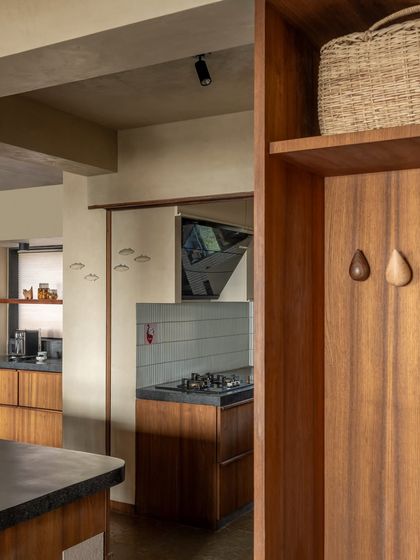 Small details, like these wooden drop-shaped hooks, add a touch of playful functionality. The kitchen is filled with these thoughtful elements that make everyday life a little more beautiful.