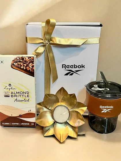 I curated this festive hamper for Reebok, combining a branded tumbler with almond brittle and a lotus-shaped candle holder. It’s a perfect example of a balanced and thoughtful corporate gift for Diwali.