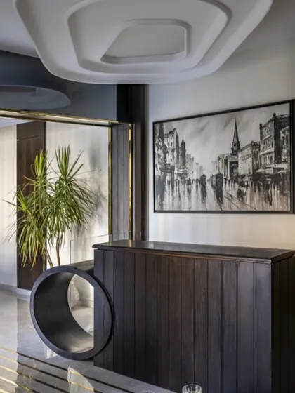 In a compact duplex, every inch matters. This hidden TV unit pops up only when needed, keeping the space sleek and clutter-free. It's a small detail that makes a big impact on modern living.