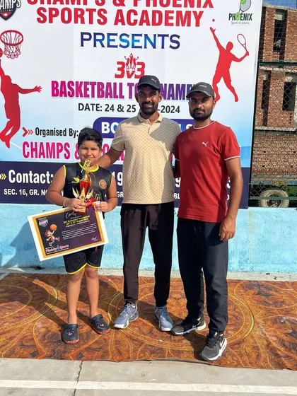 Here is one of my young champions with his trophy and certificate at a 3x3 basketball tournament. His hard work in our training sessions showed on the court.