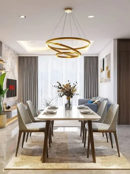A wide view of a sophisticated living and dining area. The design uses a neutral color palette, a large dining table, and a stunning ring chandelier to create a high-end look.